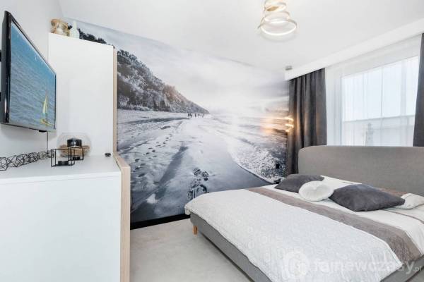 Zdjęcie przedstawia łóżko w pokoju - Premium Apartamenty Klifowa Rewal | Rewal (wypoczywaj nad morzem) 