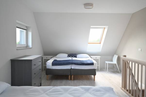 Łóżko w pokoju - domek letniskowy MEDUSA apartamenty i bungalowy
