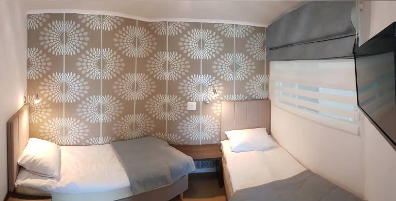 Na zdjęciu łóżko w apartamencie AKWAMARYN SPA Niechorze