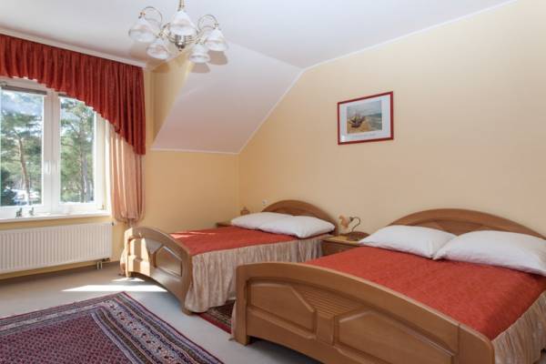Na zdjęciu przedstawiony jest pokój w pensjonacie POD LWEM w którym możecie Państwo się zatrzymać podczas pobytu w Pobierowie