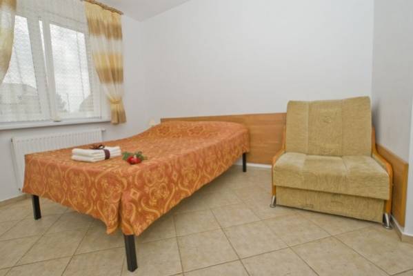 Na zdjęciu łoże w pokoju - Dom Gościnny MANGO | Rewal (wypoczywaj nad morzem) 