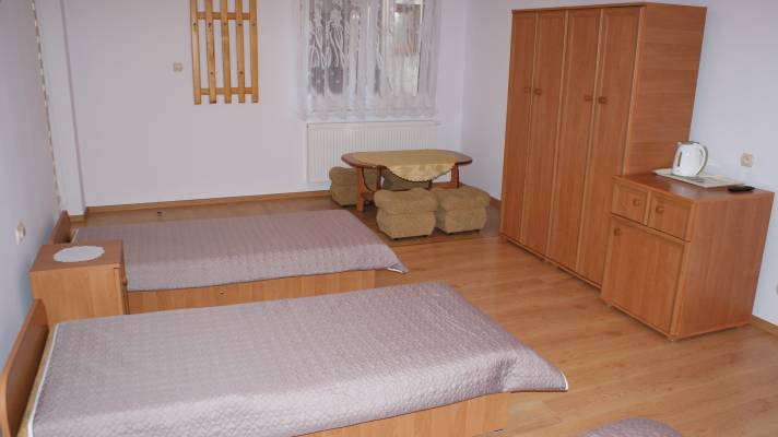 Fotografia przedstawia łoże w pensjonacie Dom Gościnny JAŚMIN