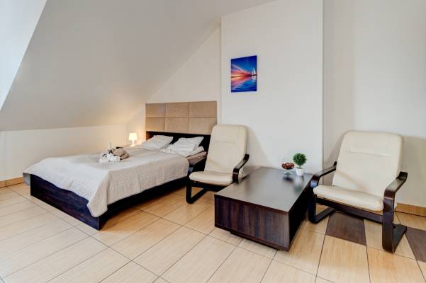 Zdjęcie przedstawia spanie w pokoju - Ambre Mare | Pobierowo (wypoczywaj nad morzem) 