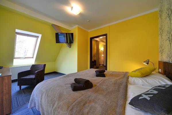 Fotografia przedstawia łóżko w pokoju - PETRUS | Karpacz (wypoczywaj w górach) 
