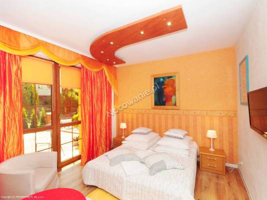 Na zdjęciu łóżko w pokoju - Villa MORENA | Rewal (wypoczywaj nad morzem) 