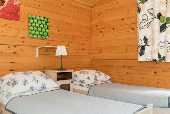 Ośrodek Wypoczynkowy Domki i Pokoje BOSMAN w Rewalu - zdjęcie łóżka
