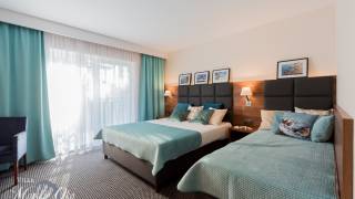 Zdjęcie przedstawia łoże w pokoju - Villa MORSKIE OKO | Pogorzelica (wypoczywaj nad morzem) 